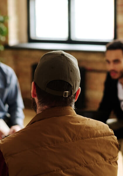 rear-view-of-one-man-in-group